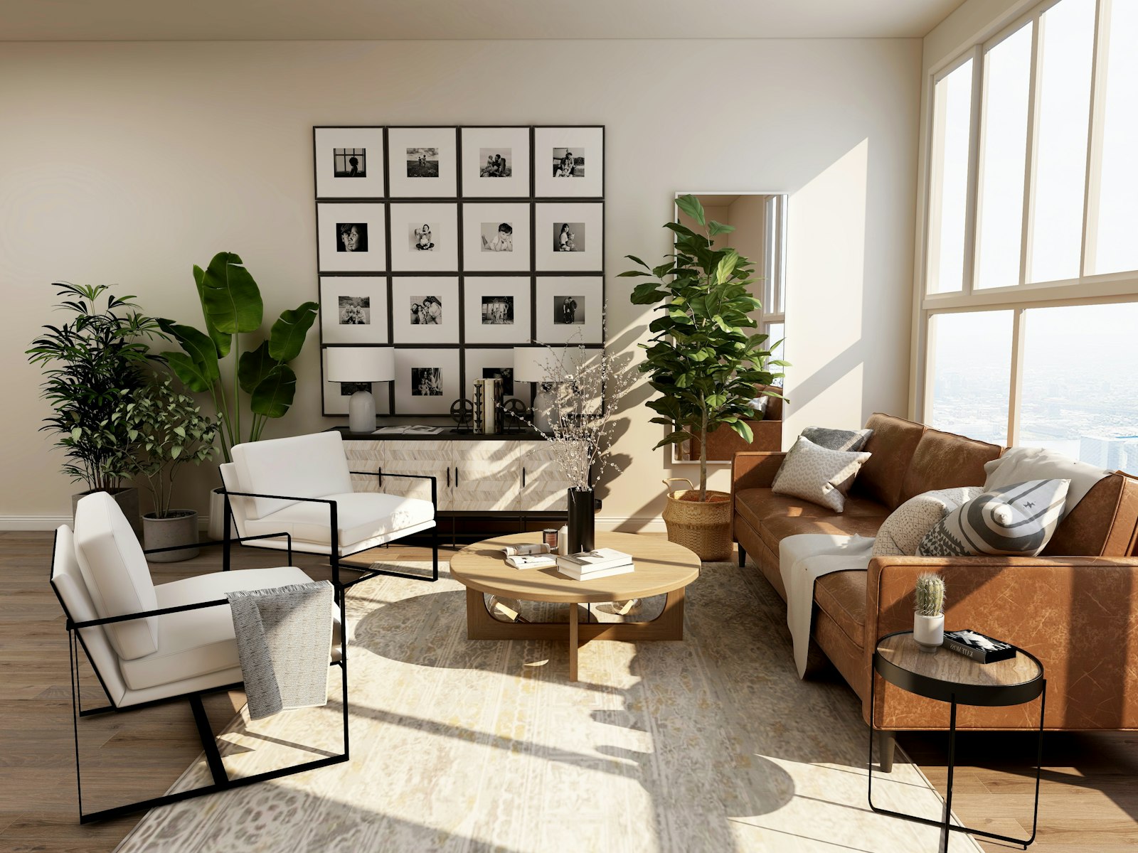 A bright living room with tall windows, white lounge chairs and a leather sofa